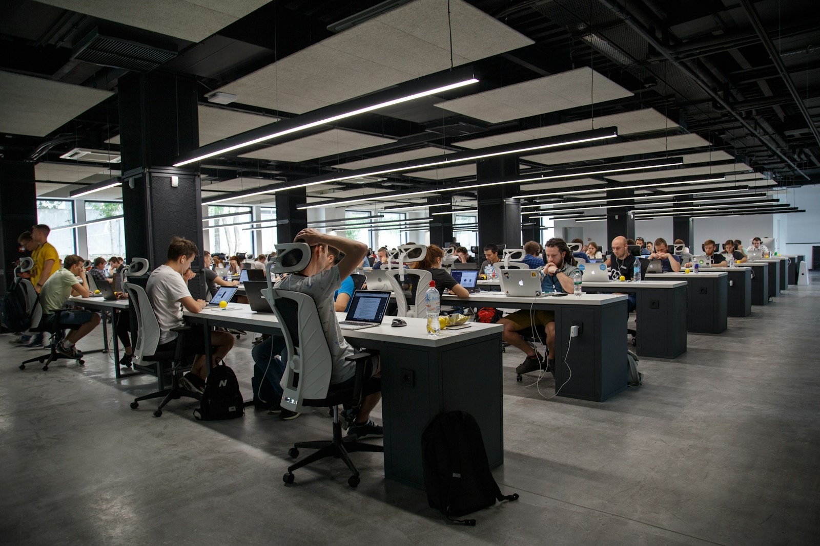 Toronto newsroom floor with editors at work under evening light