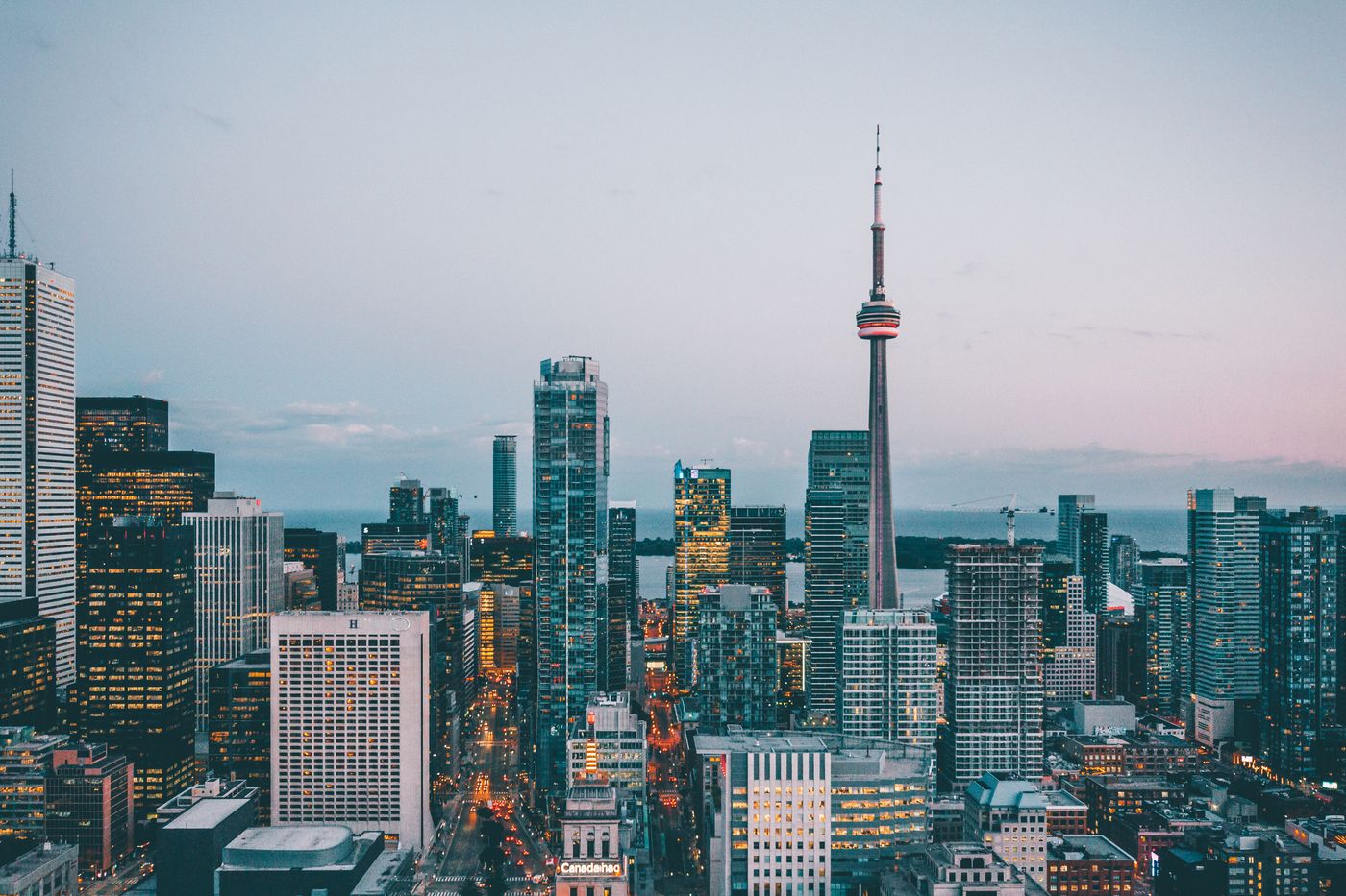Toronto skyline at dusk with illuminated towers